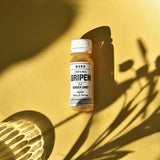 MONO Vitaminshot Gripen vor gelben Hintergrund mit Schatten