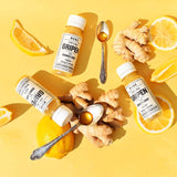 MONO Gripen Shot vor gelben Hintergrund mit Ingwer, Honig und Zitrone
